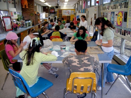 Students from Howe Elementary in Dearborn work with Mexican artist, Demetrio Aguilar, to create murals for their school